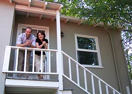 Owners Breton and Karrie Buckley on the steps of their peaceful bed and breakfast in San Diego. 